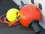 A close up of the new satellite location buoy on the deck of a boat. 